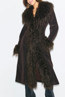 Dark brown faux fur figure-hugging coat with shaggy front trim and cuffs, front view on model, cropped