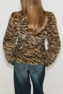 Tiger print faux fur shaped jacket with long sleeves and cropped length, back view on model