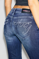Dark blue bootcut jeans, close-up of the rhinestone Miss Y logo on the back pocket and Miss Y label
