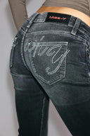 Black bootcut jeans, close-up of the rhinestone Miss Y logo on the back pocket