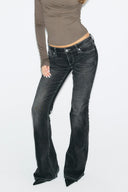 Black loose-fit low-waist bootcut tall jeans with wide bootcut leg and full length, front view on model