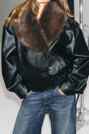 Black faux leather jacket, close-up of the brown faux fur collar, button front and elasticated waist