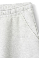Grey melange sweatpants, close-up of the elastic waist, side pocket and tonal Miss Y logo