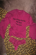 Berry boost (dark pink) crew neck top with long sleeves and text print, laid flat with a lace thong on a leopard print rug