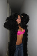 Raspberry rose (pink) lace push-up bra with scalloped lace edge, styled with a black faux fur coat in a hallway