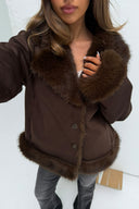 Brown faux fur jacket with fur collar and button front, close-up front view on model