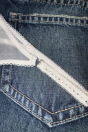 Gardenia (off-white) mesh thong, close-up of the rhinestone-studded strap and metal ring