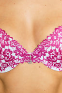 Blue and pink lace push-up bra, close-up of the pendant at the centre front