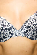 White and navy lace push-up bra, close-up of the lace cups and centre front